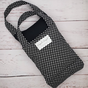 May include: Black and white polka dot tote bag with a white label that says "Wrapped in Comfort Handmade".