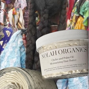 May include: A white jar with a black label that reads "NOLAH ORGANICS Chebe and Palm Oil Moisturizing Hair Butter". The label lists the ingredients: Refined Shea Butter, Palm Oil, Coconut Oil, Chebe Powder, Pumpkin Seed Oil, Jamaican Black Castor Oil, Nutmeg and Rosemary Essential Oils, Vitamin E.
