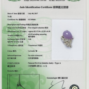 May include: Jade Identification Certificate for a lavender pear-shaped cabochon jade ring with diamonds. The certificate states the jade is natural Fei Cui (Jadeite Jade) - Type A. The certificate is dated July 08, 2017 and the certificate number is SC105604.