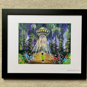 May include: A framed painting of a UFO hovering over a forest with three figures standing in the light beams. The figures are wearing colorful clothing and have wings. The background is a dark blue sky with stars and a purple and green aurora borealis.