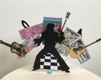 May include: Black silhouette of Elvis Presley with a microphone, a chequered floor, and a guitar. There are several vintage concert posters and tickets surrounding him, including one that says "Elvis In Person!" and another that says "Sold Out!"