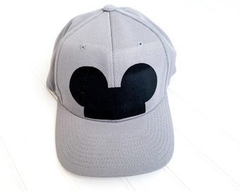 May include: A gray baseball cap with a black Mickey Mouse ears design.