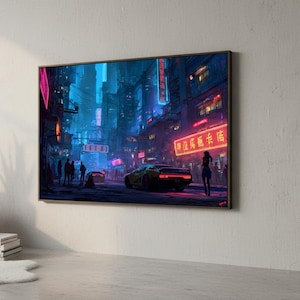 May include: A framed digital art print depicting a futuristic cityscape at night. The scene is illuminated by neon lights in shades of pink, blue, and red. A yellow sports car is parked on the street, and figures of people are visible.
