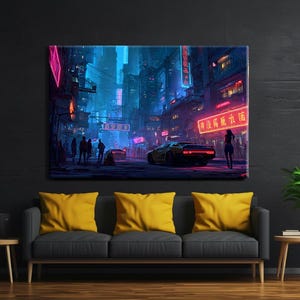 May include: A canvas print depicting a futuristic cityscape at night. The scene is dominated by neon lights in shades of pink, blue, and red, with a yellow sports car and silhouetted figures. The artwork is displayed above a gray sofa with yellow cushions.