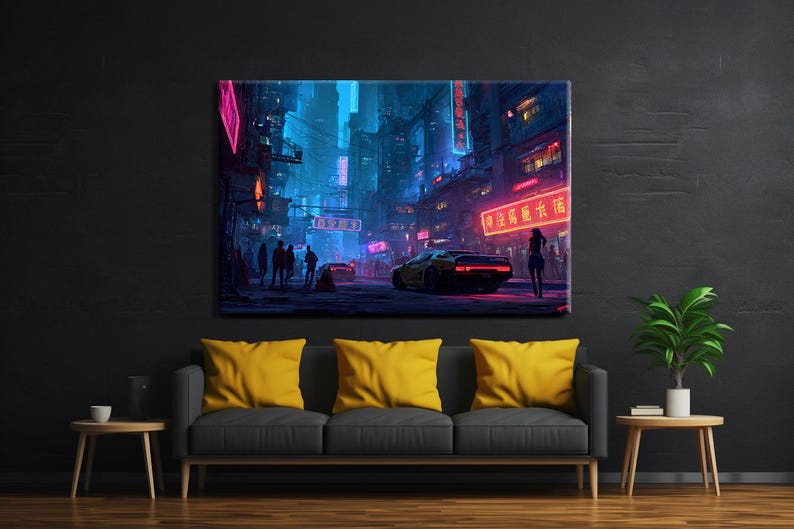 May include: A canvas print depicting a futuristic cityscape at night. The scene is dominated by neon lights in shades of pink, blue, and red, with a yellow sports car and silhouetted figures. The artwork is displayed above a gray sofa with yellow cushions.