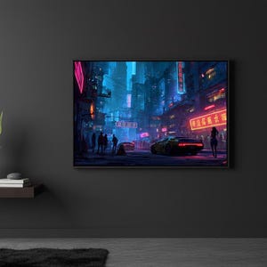 May include: A framed digital art print depicting a futuristic cityscape at night. The scene features neon lights, a yellow sports car, and silhouetted figures. The artwork is mounted on a dark gray wall.