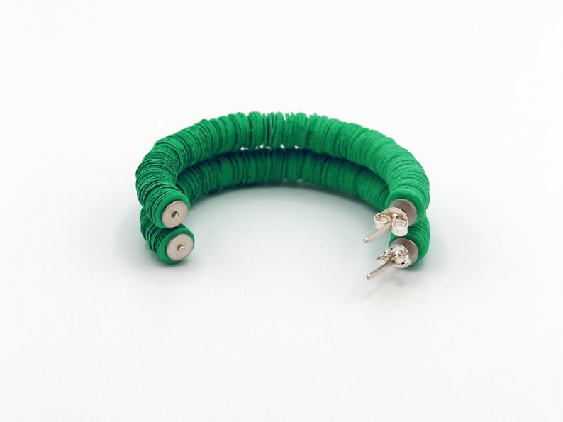 The perfect gift for her, the unique green Helen hoop earrings were handmade in the UK using recycled materials.