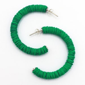 The unique green Helen hoop earrings handmade in the UK using recycled materials.