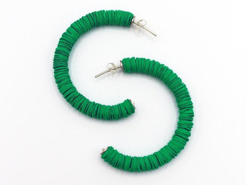 The unique green Helen hoop earrings handmade in the UK using recycled materials.