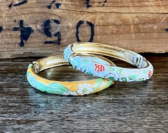 1980s set of two enamel bracelets.