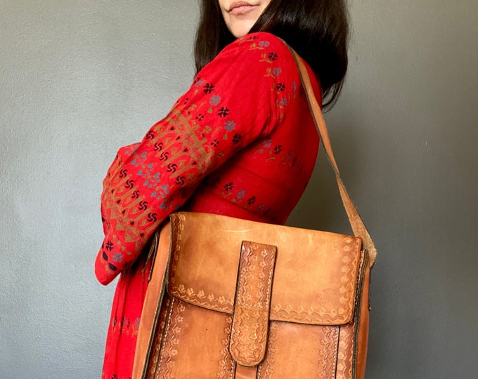 Featured listing image: 1970s tooled leather satchel bag.