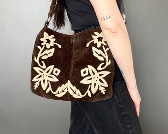 1970s style brown suede shoulder bag with flower appliqué