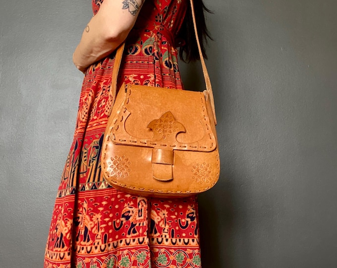 Featured listing image: 1970s tooled leather satchel bag.