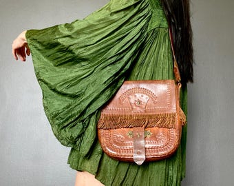 ON HOLD!! Don’t buy! 1970s tooled leather satchel bag.