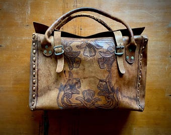 1970s tooled leather weekend travel bag.