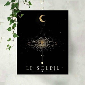 May include: A black and gold minimalist art print with a crescent moon, a circle with a star inside, and the text "LE SOLEIL" in gold lettering.