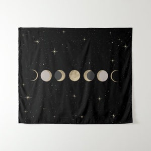 May include: A black tapestry with a gold and gray moon phases design on a black background with gold stars.