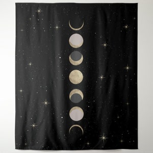 May include: A black tapestry with a white starry night sky background and a vertical row of gold and gray crescent moons.