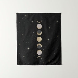 May include: A black tapestry with a white and gold moon phases design. The tapestry features a starry night sky background.