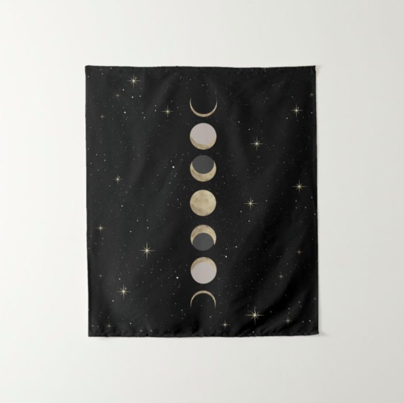 May include: A black tapestry with a white and gold moon phases design. The tapestry features a starry night sky background.