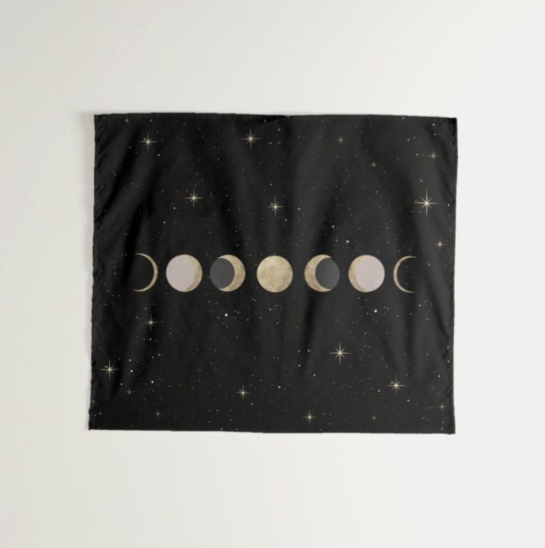 May include: Black tapestry with a gold and white moon phase design on a black background with white stars.