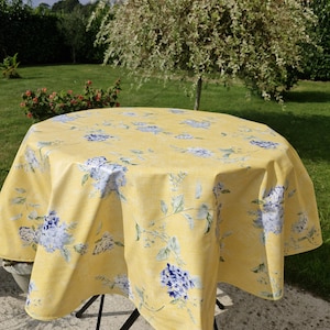 Round oilcloth 155cm wide yellow and blue.