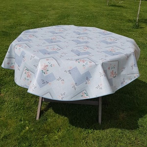 Round oilcloth 155cm wide blue and pink flowers.