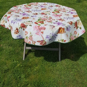 Round oilcloth 155cm wide with flowers.