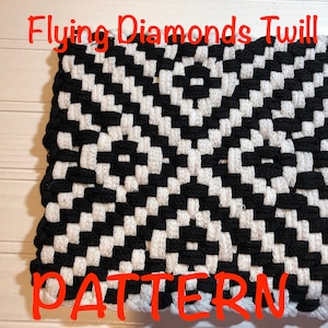 May include: Black and white woven pot holder with a diamond pattern. The pot holder has a loop for hanging. The text "Flying Diamonds Twill PATTERN" is written in red at the top and bottom of the image.