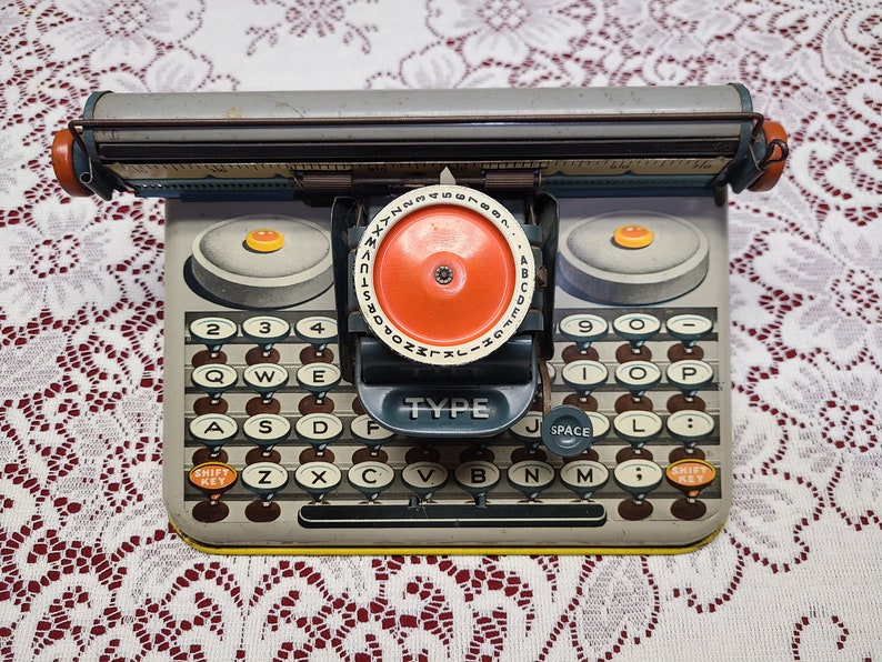 Vintage UNIQUE Tin Litho Toy Dial Typewriter dependable Uneek Artie