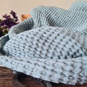 May include: A set of three ceramic mugs with a speckled, matte finish. The mugs are in shades of cream, light gray, and dark gray. Each mug has a simple, minimalist design, perfect for coffee or tea.