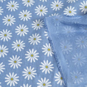 blue linen fabric with white chamomile daisy print single sided natural back side