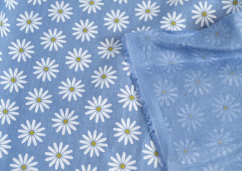 blue linen fabric with white chamomile daisy print single sided natural back side