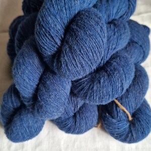Blue 100 % wool yarn. Natural lanolin yarn