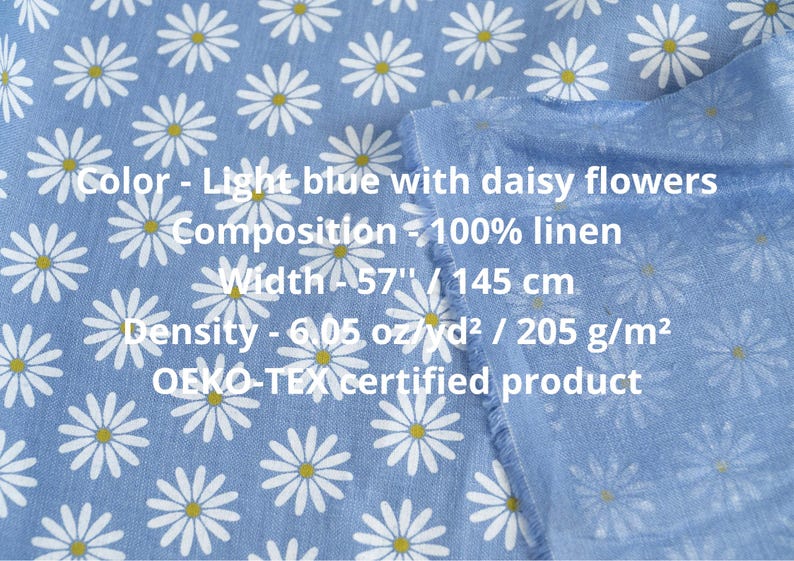 medium weight linen fabric light blue with small white floral daisy pattern close up