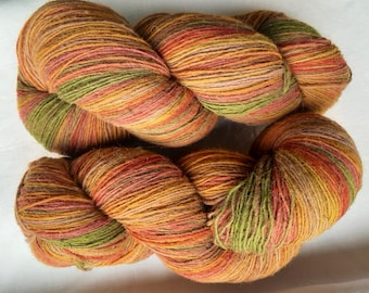 Wool yarn for knitting. High quality multicolor orange,  green , grey, red striped  yarn. Natural lanolin yarn.
