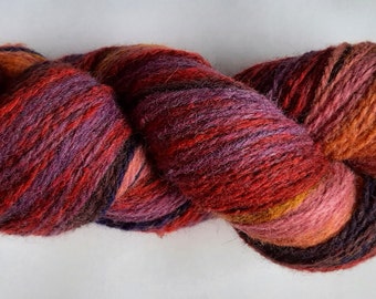 Wool yarn for knitting. High quality multicolor red purple hand dyed yarn. Natural lanolin yarn.