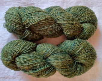 Wool yarn for knitting. High quality  green hand dyed 100 % merino wool yarn. Natural lanolin yarn.