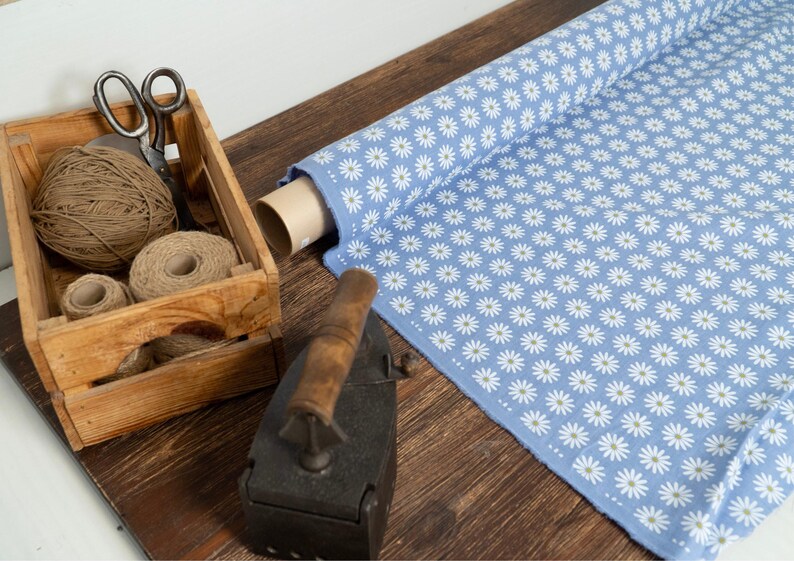 blue linen fabric with white chamomile daisy print single sided natural back side
