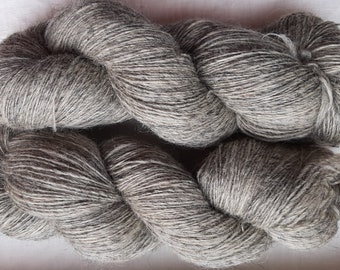 Wool yarn for knitting. High quality natural gray  100 % merino wool yarn. Natural lanolin yarn.