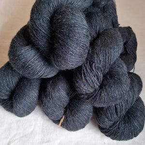 Black wool yarn. Natural lanolin yarn.