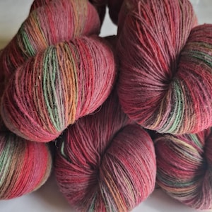 Wool yarn for knitting. High quality multicolor  raspberry pink , green striped 100% wool yarn. Natural lanolin yarn.