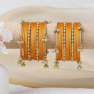 Amani Kashmiri-armband in goudgeel