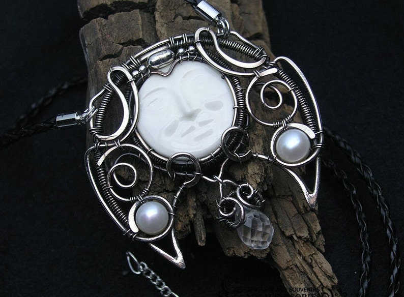 Pendant-talismn Lunnitsa Jewelry-amulet with pearls and ceramic cabochon in the shape of the face of the moon Pendant in Victorian style.