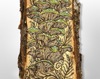May include: A hand-painted wood slice featuring a cluster of green and yellow mushrooms with intricate line details. The artwork includes fern-like foliage and decorative swirls, set against a light brown background with a natural bark edge.