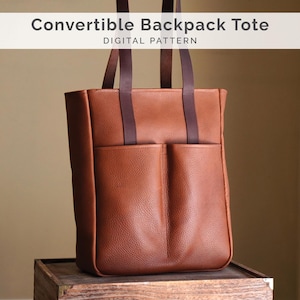 May include: A tan, textured leather convertible backpack tote with two vertical front pockets and two dark brown shoulder straps. The text "Convertible Backpack Tote DIGITAL PATTERN" is displayed in a white banner at the top of the image.