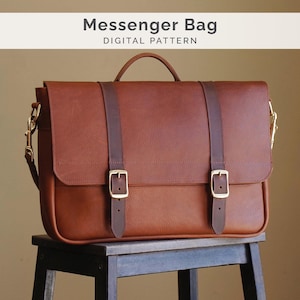 May include: A brown leather messenger bag with a handle, two buckle straps, and gold-colored hardware. The bag is sitting on a small wooden stool. Text on the image reads "Messenger Bag DIGITAL PATTERN".