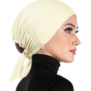 soft cotton bonnet beanie undercap in off white ivory cream color with sashes to tie back for a secure hair wrap