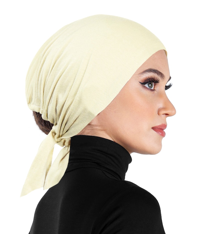 soft cotton bonnet beanie undercap in off white ivory cream color with sashes to tie back for a secure hair wrap