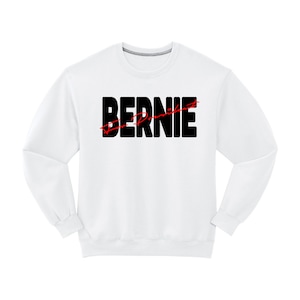 May include: White long-sleeved sweatshirt with black text that reads "Bernie" with a red line through the word "President".